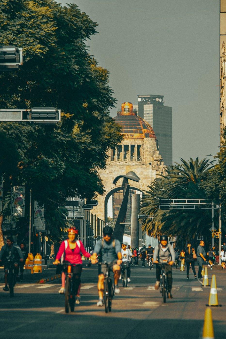 A group of cyclists riding together on a street in Ciudad de Mexico.