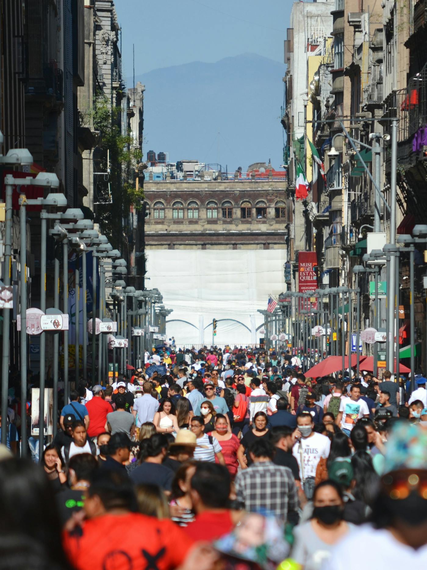 People walking through a crowded street in Mexico City.