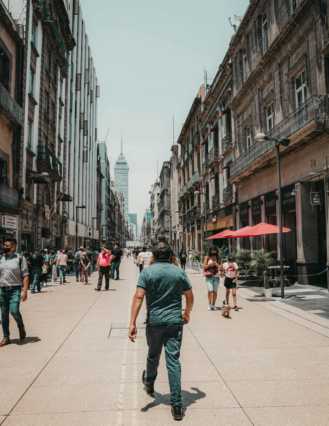 People walking near Torre Latinoamericana in Mexico City.