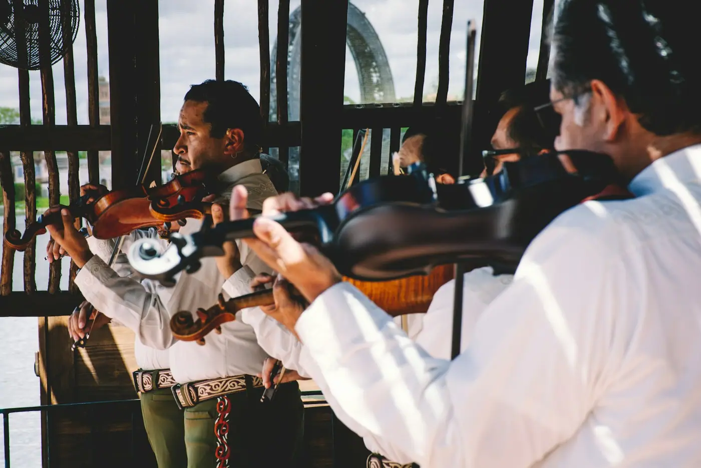 A group of musicians playing instruments in front of a crowd.