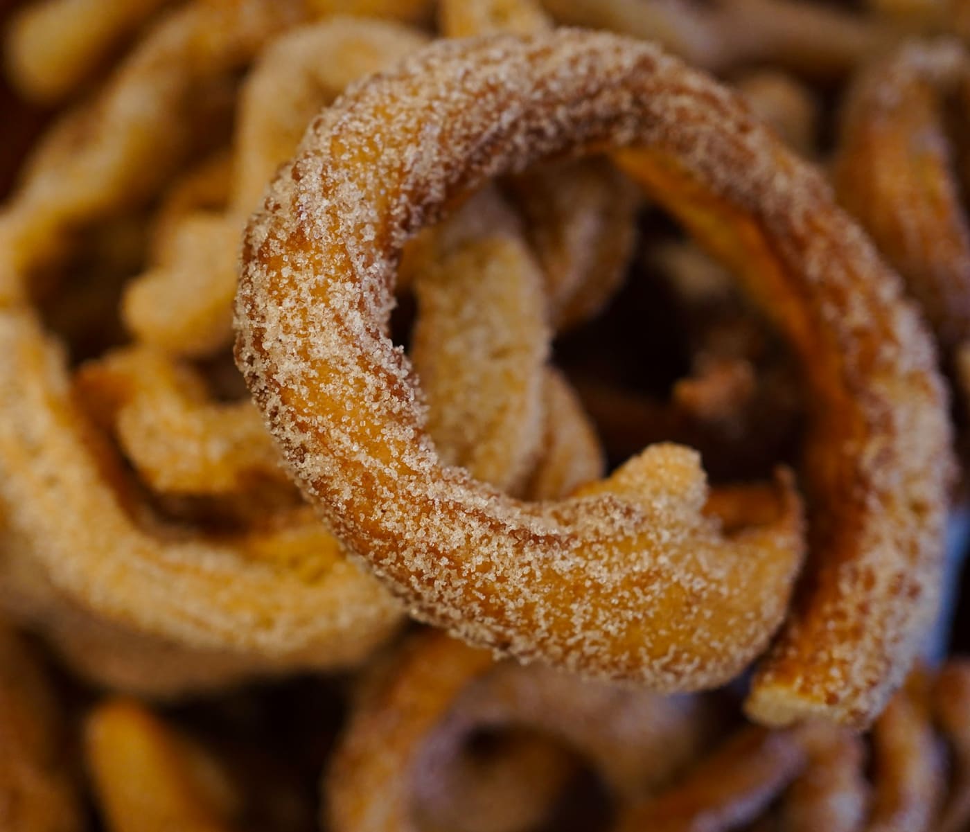 A close-up of freshly fried churros.