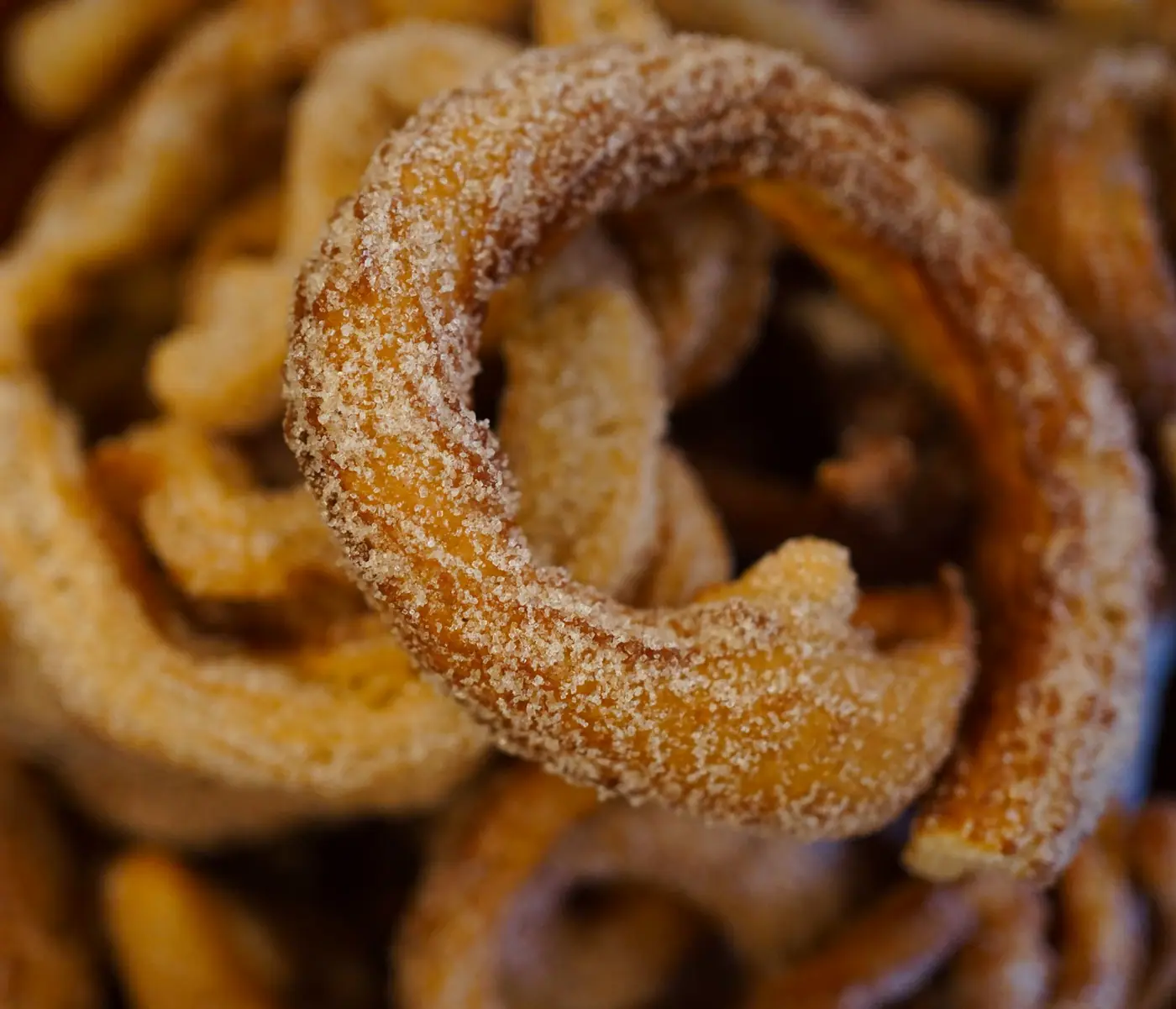 A close-up of freshly fried churros.