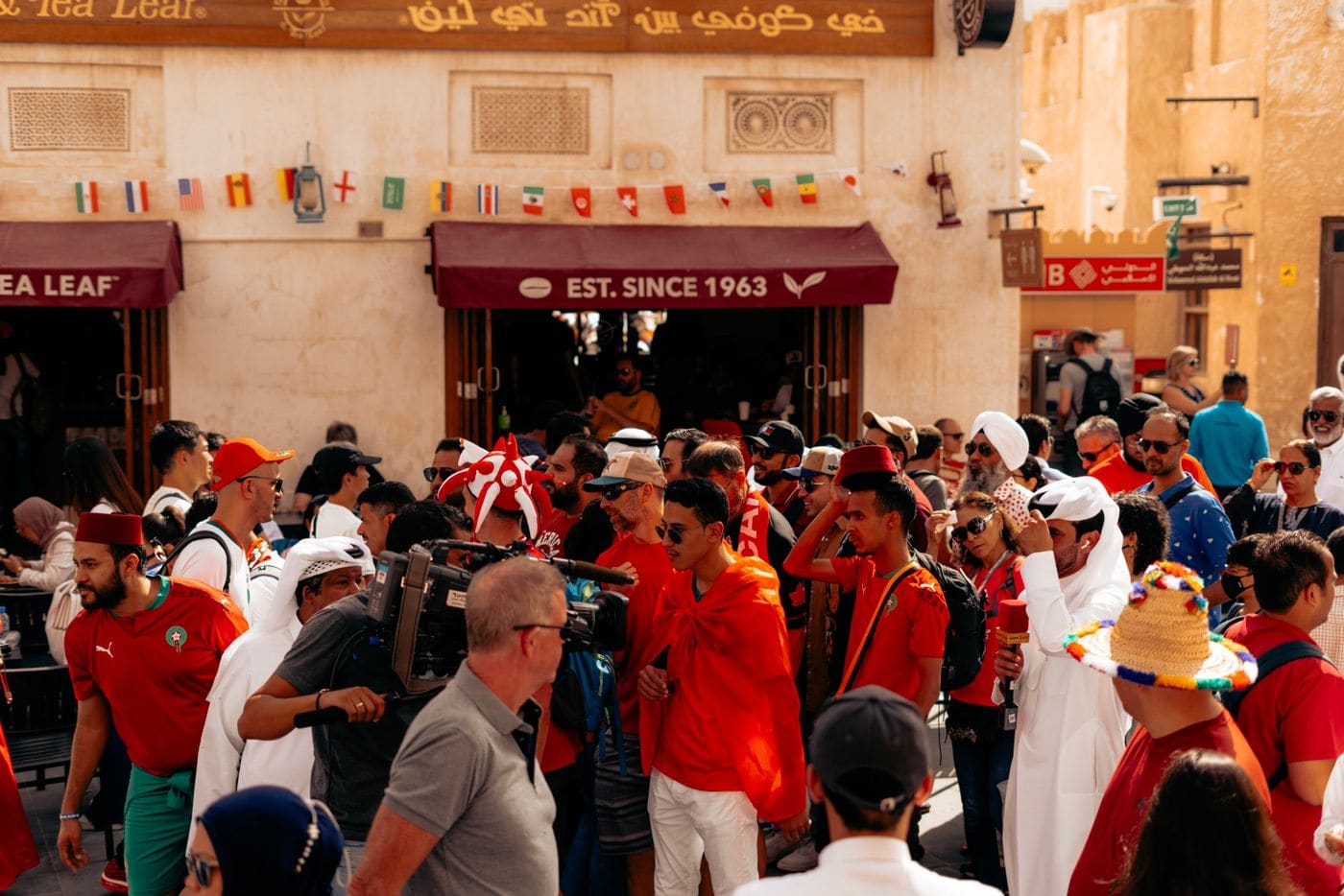 People watching soccer together in a lively fan setting.