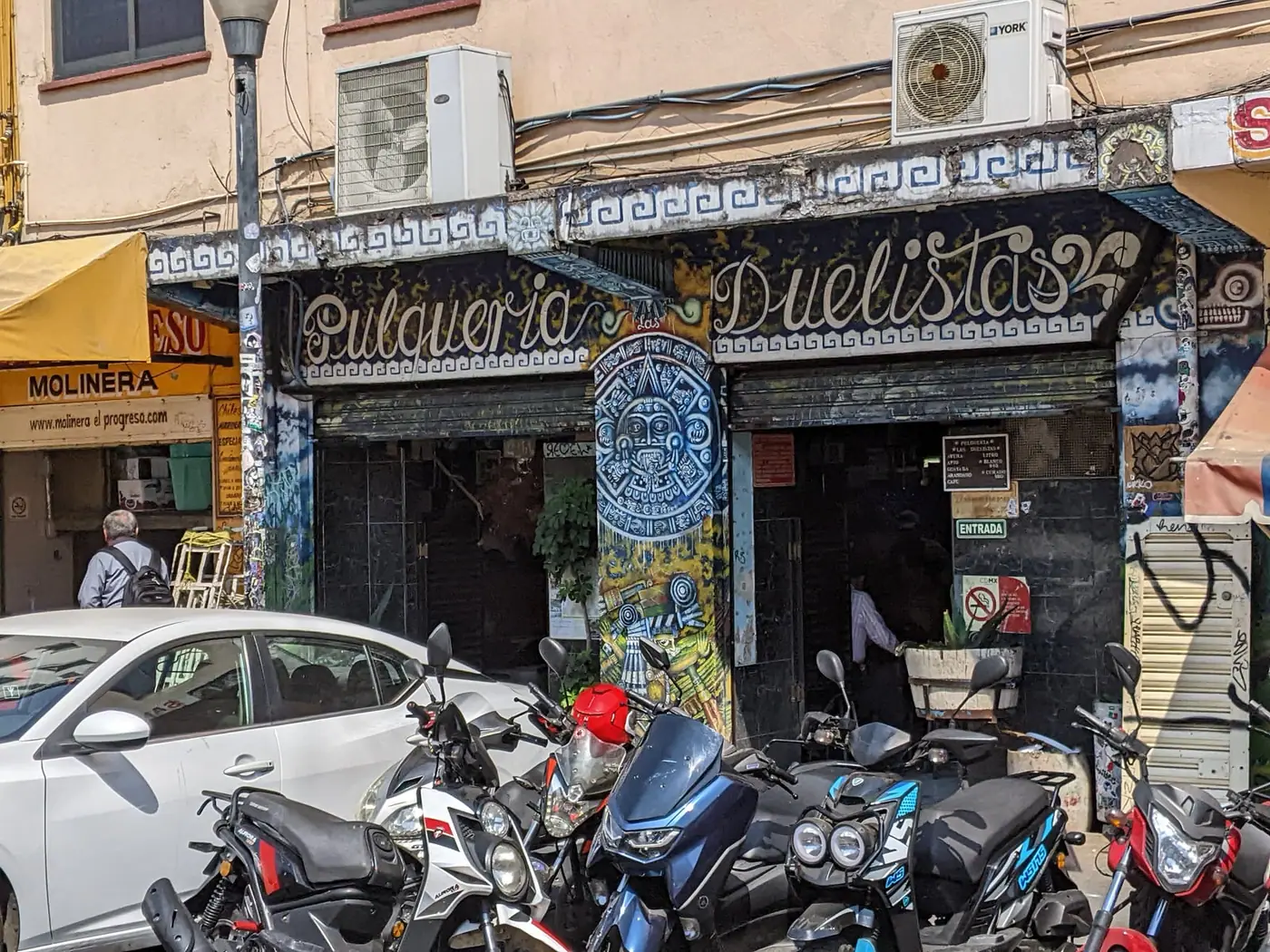 The painted facade of Pulqueria Duelistas in Mexico City