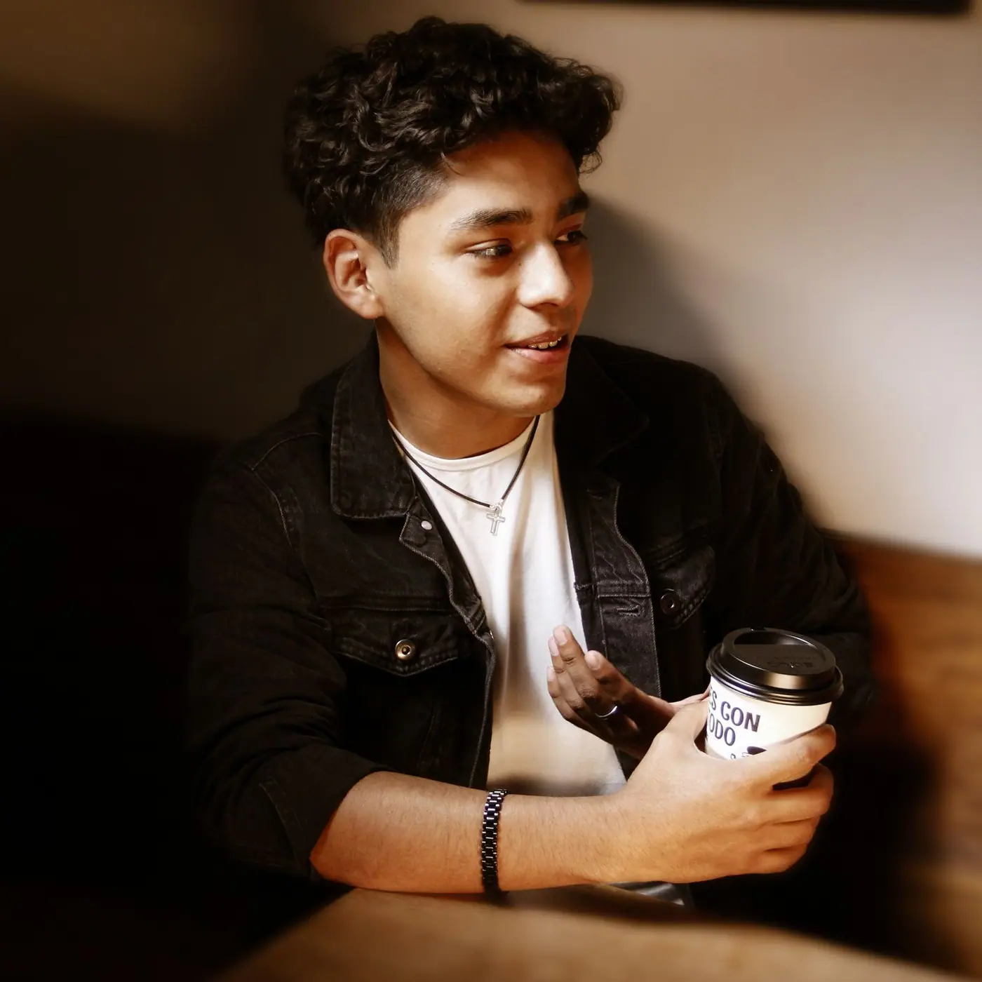 A man speaking in a Mexico City cafe.