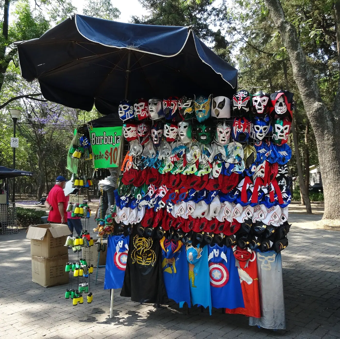 A street stall in Mexico City selling rows of lucha libre masks