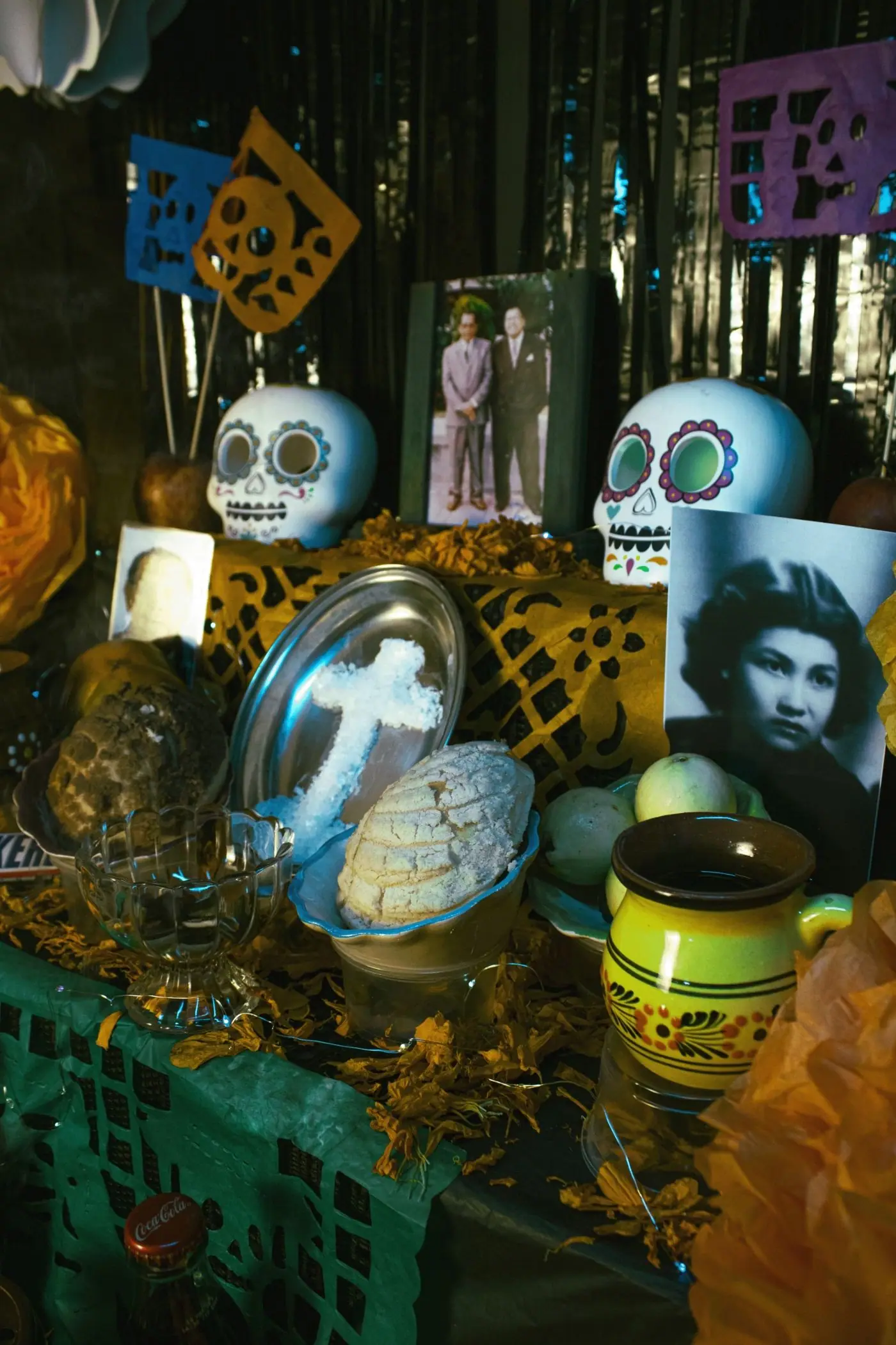 Colorful sugar skulls with piped icing decorations at a Día de Muertos market stall