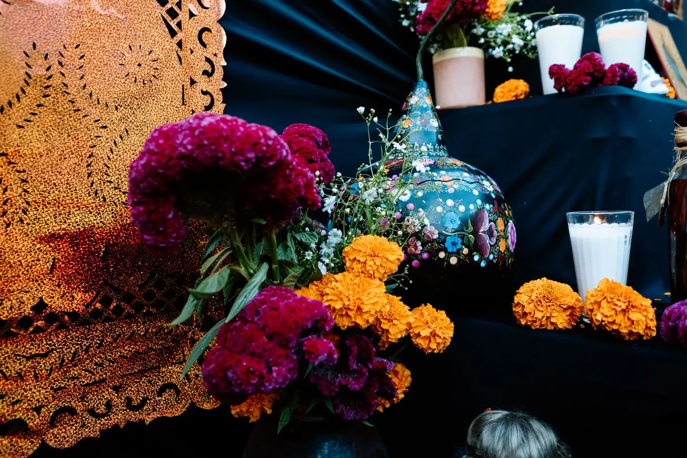 Handmade calaveritas de azúcar decorated with bright icing flowers and swirls