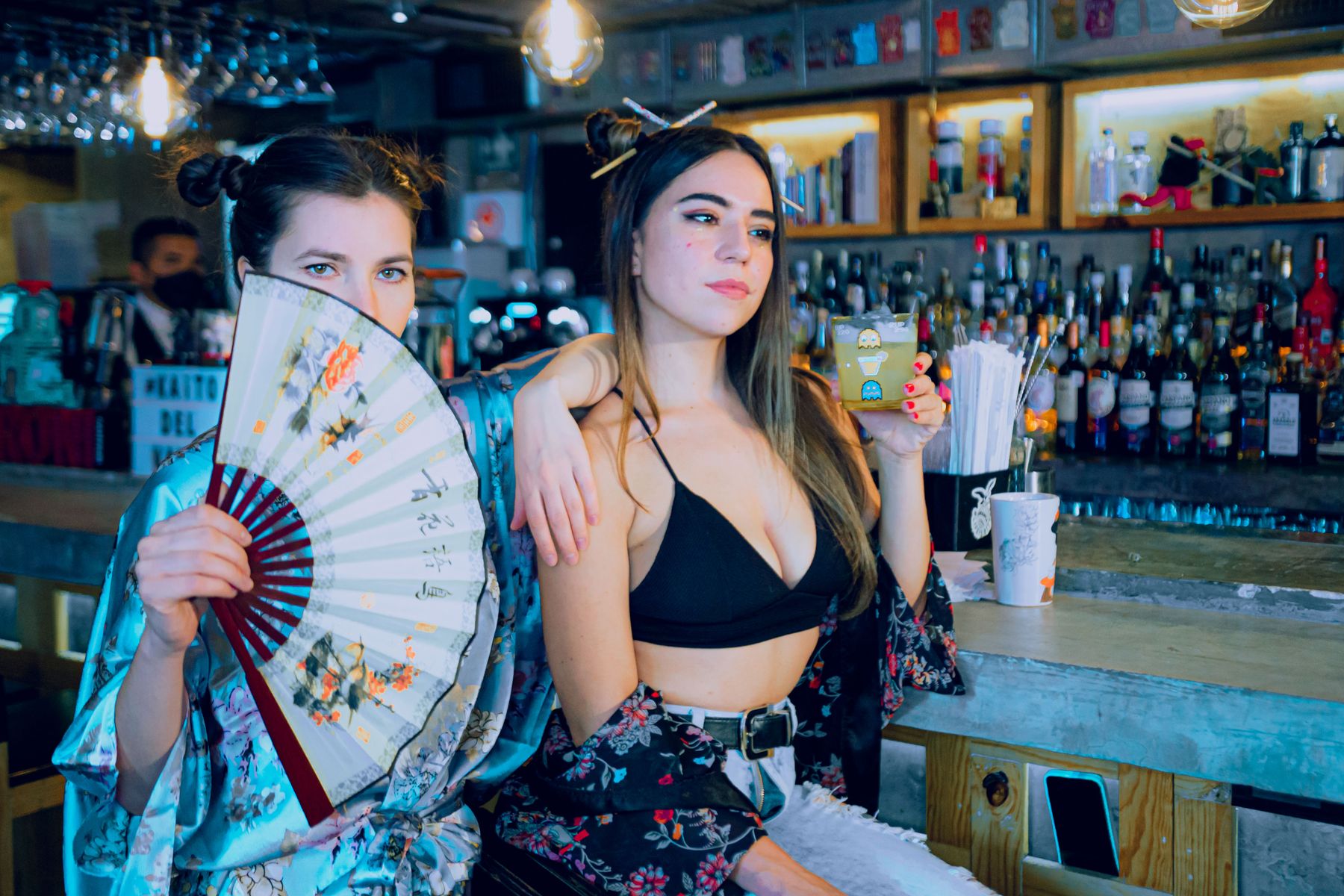 Two people with drinks in a Mexico City bar.