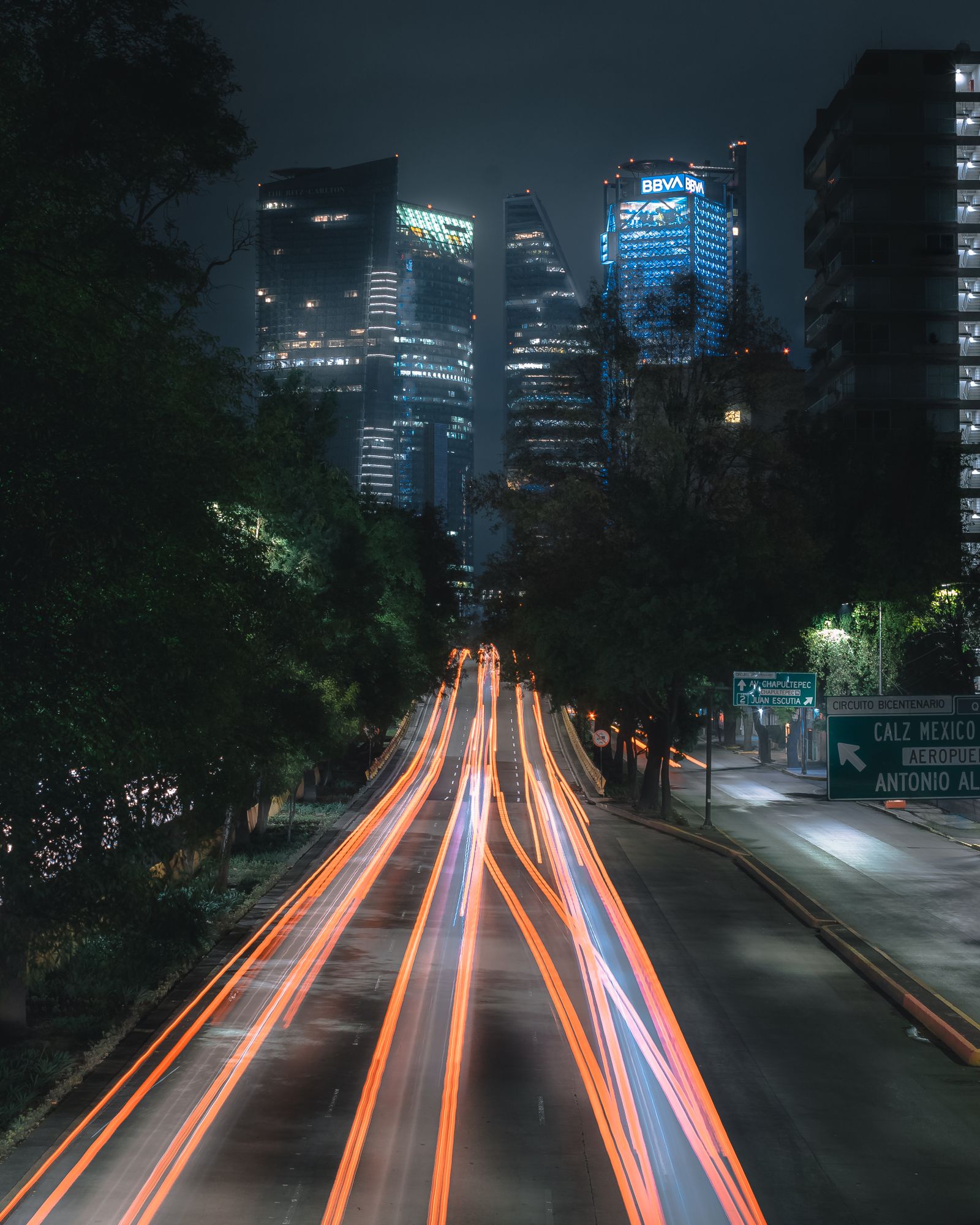 Long-exposure traffic lights in Mexico City at night.