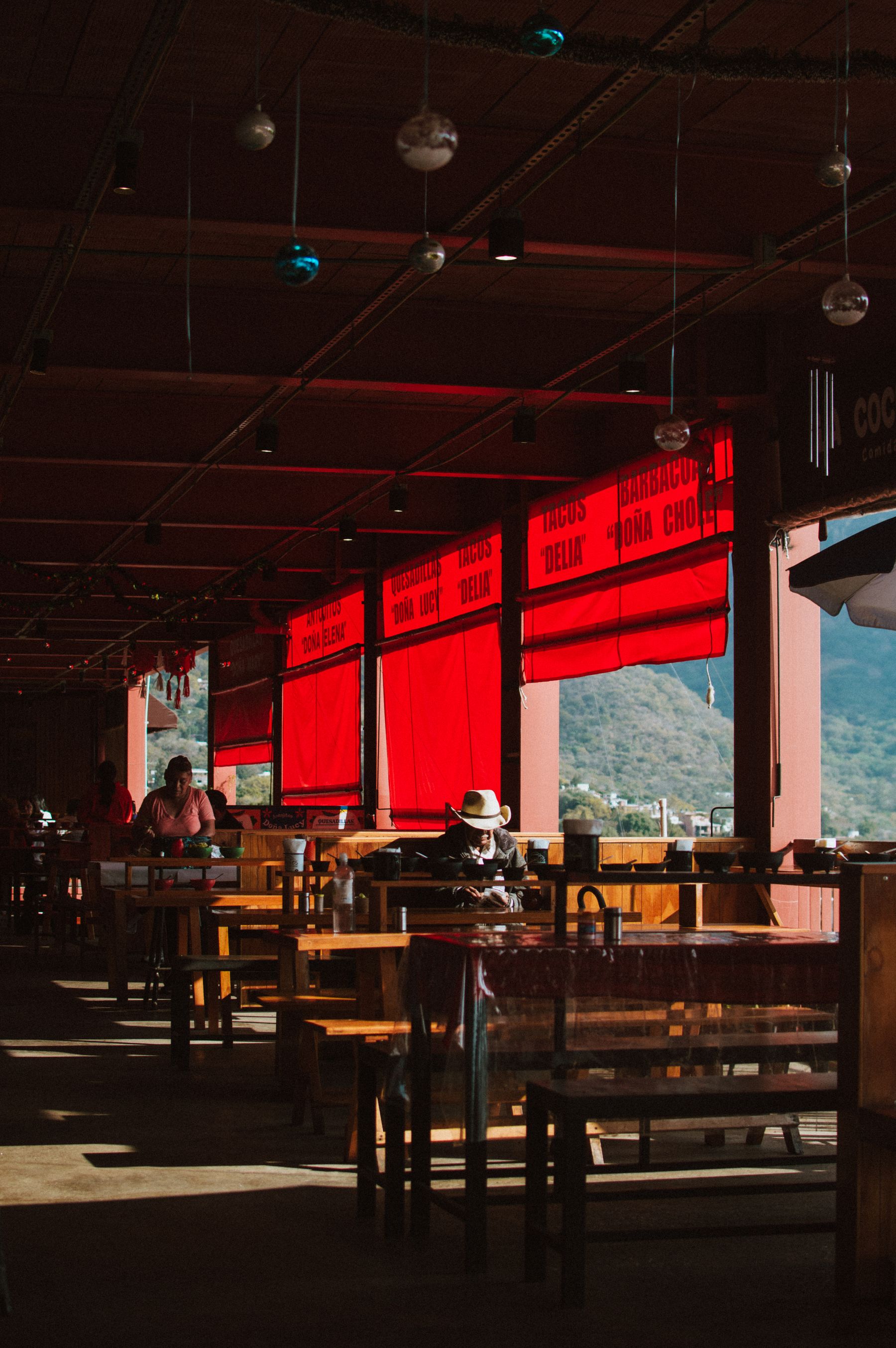 A cozy cafe with red accents in Mexico City.