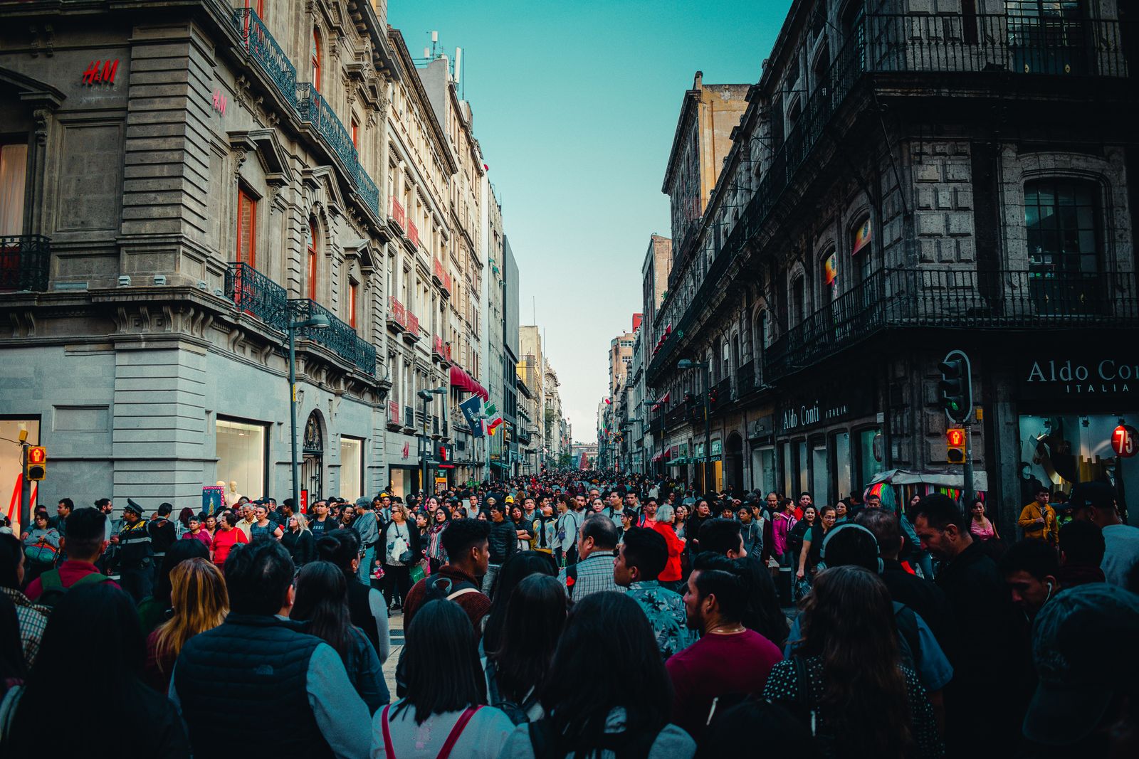 People packed into a downtown Mexico City pedestrian street.